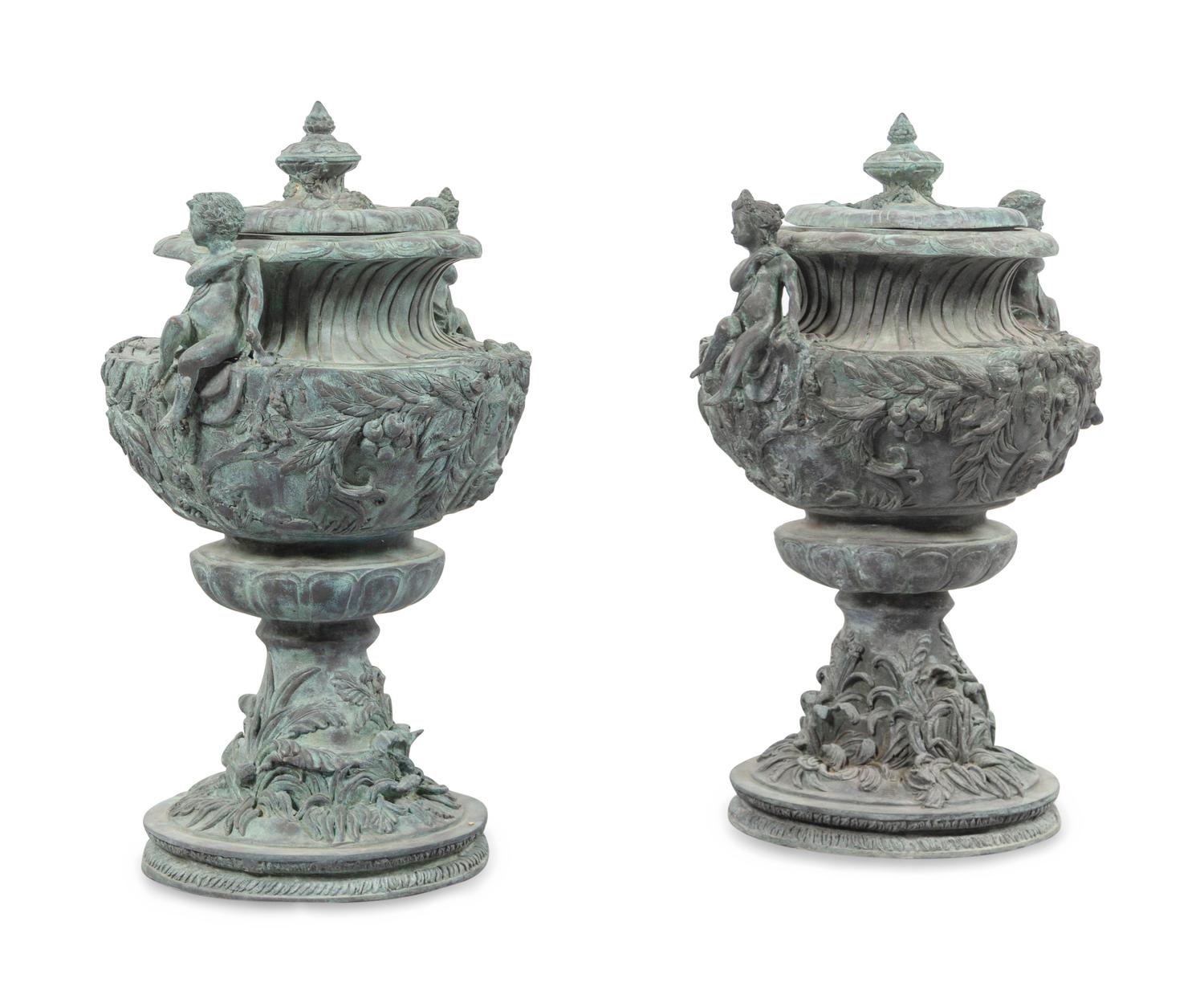 A Pair of Louis XV Style Cast Iron Covered Garden Urns