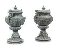 A Pair of Louis XV Style Cast Iron Covered Garden Urns