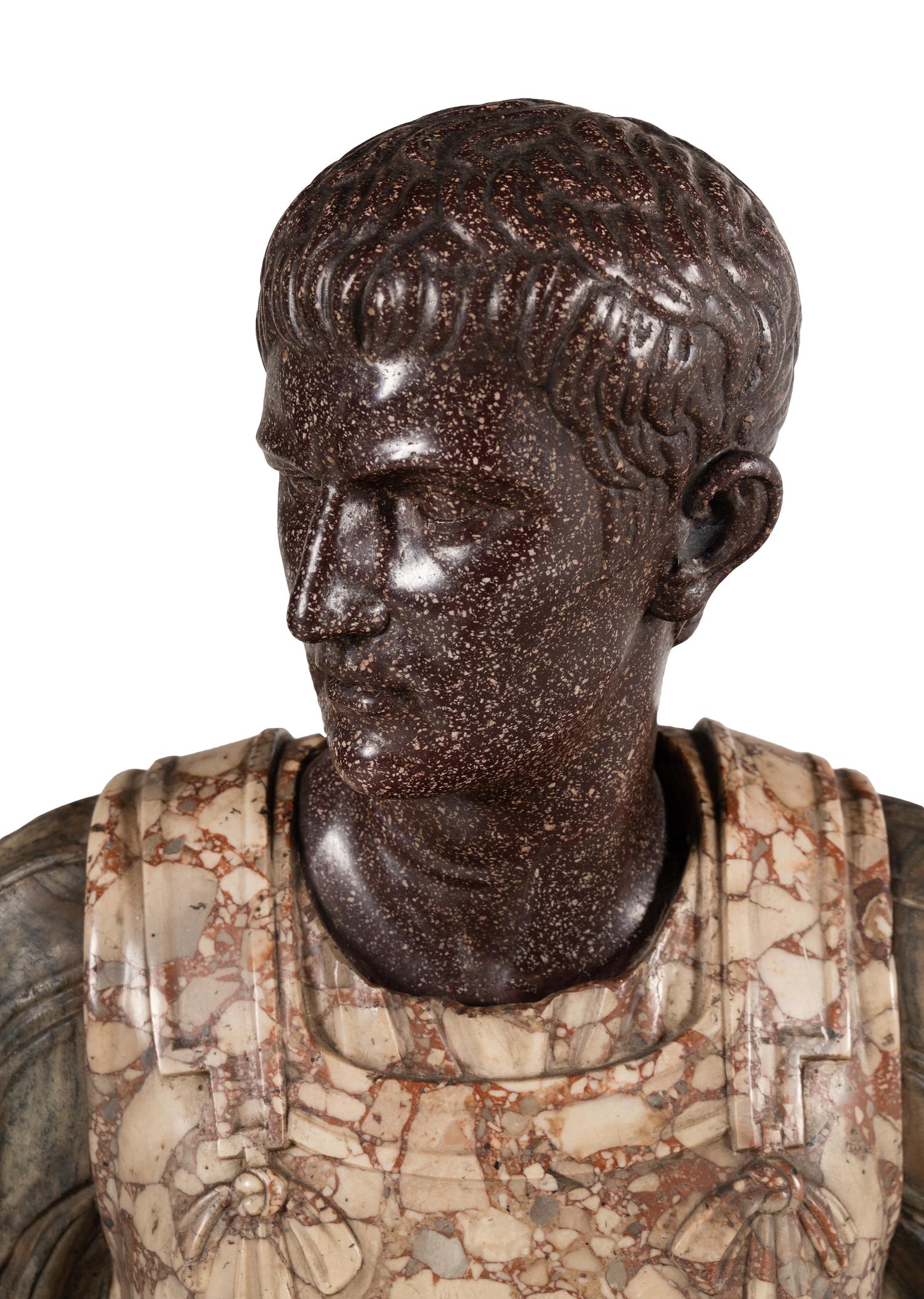 An Italian Carved Breccia Marble and Porphyry Bust of Augustus