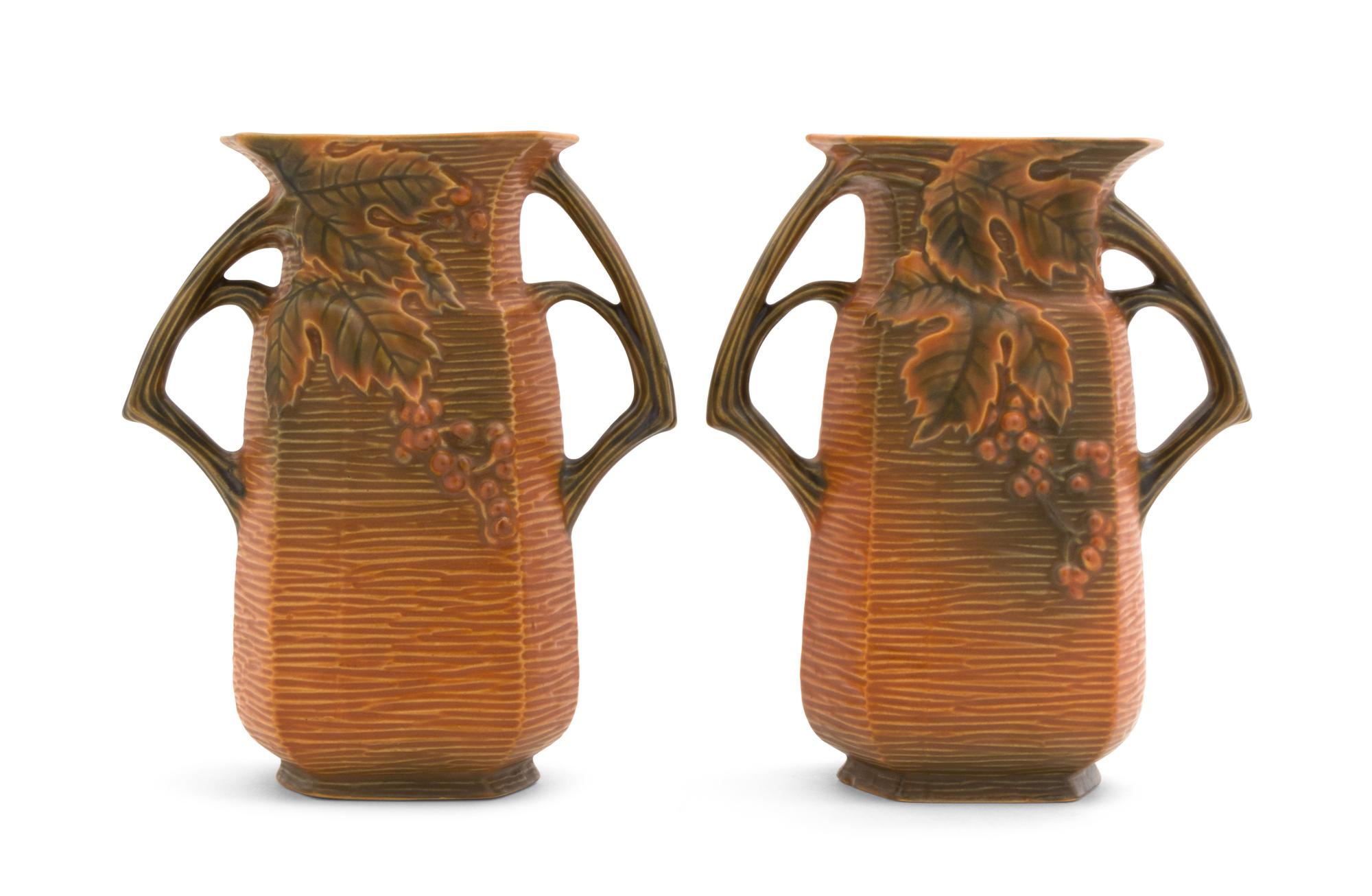 A Pair of Roseville Bushberry Pottery Vases Height 8 1/4 inches.