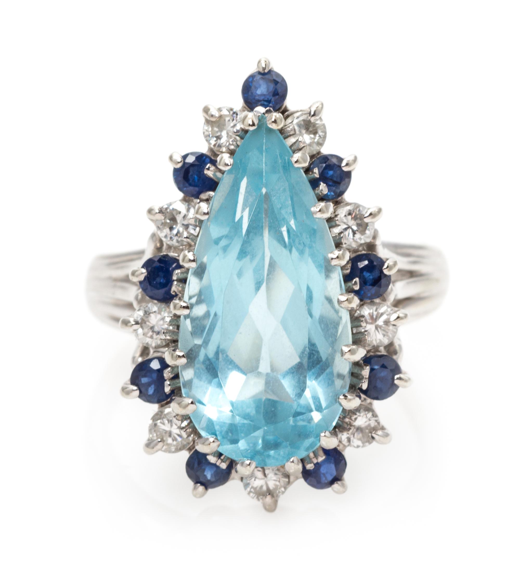 A 14 Karat White Gold, Aquamarine, Diamond and Sapphire Ring, 4.00 dwts.