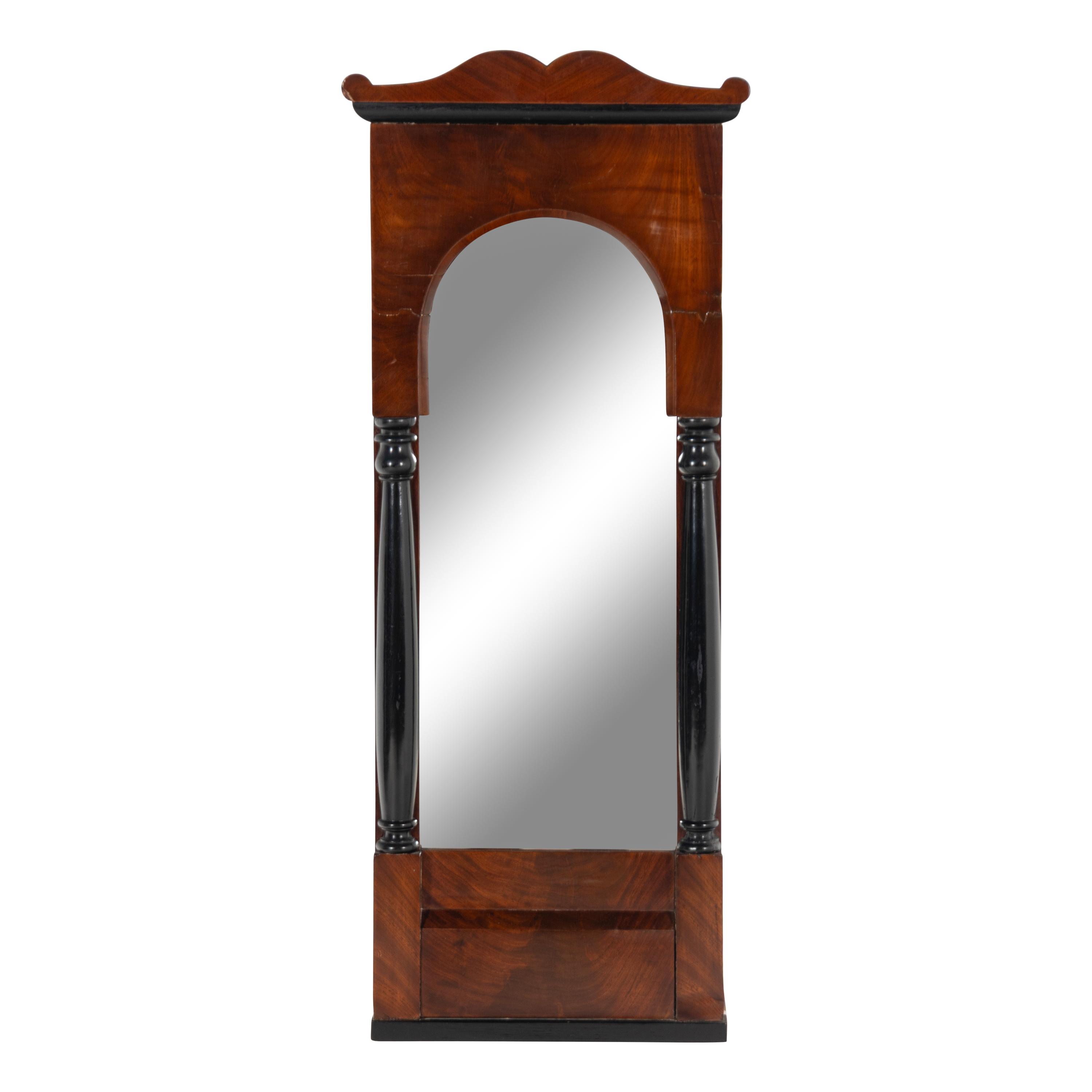 An Austrian Neoclassical Mahogany and Part Ebonized Mirror