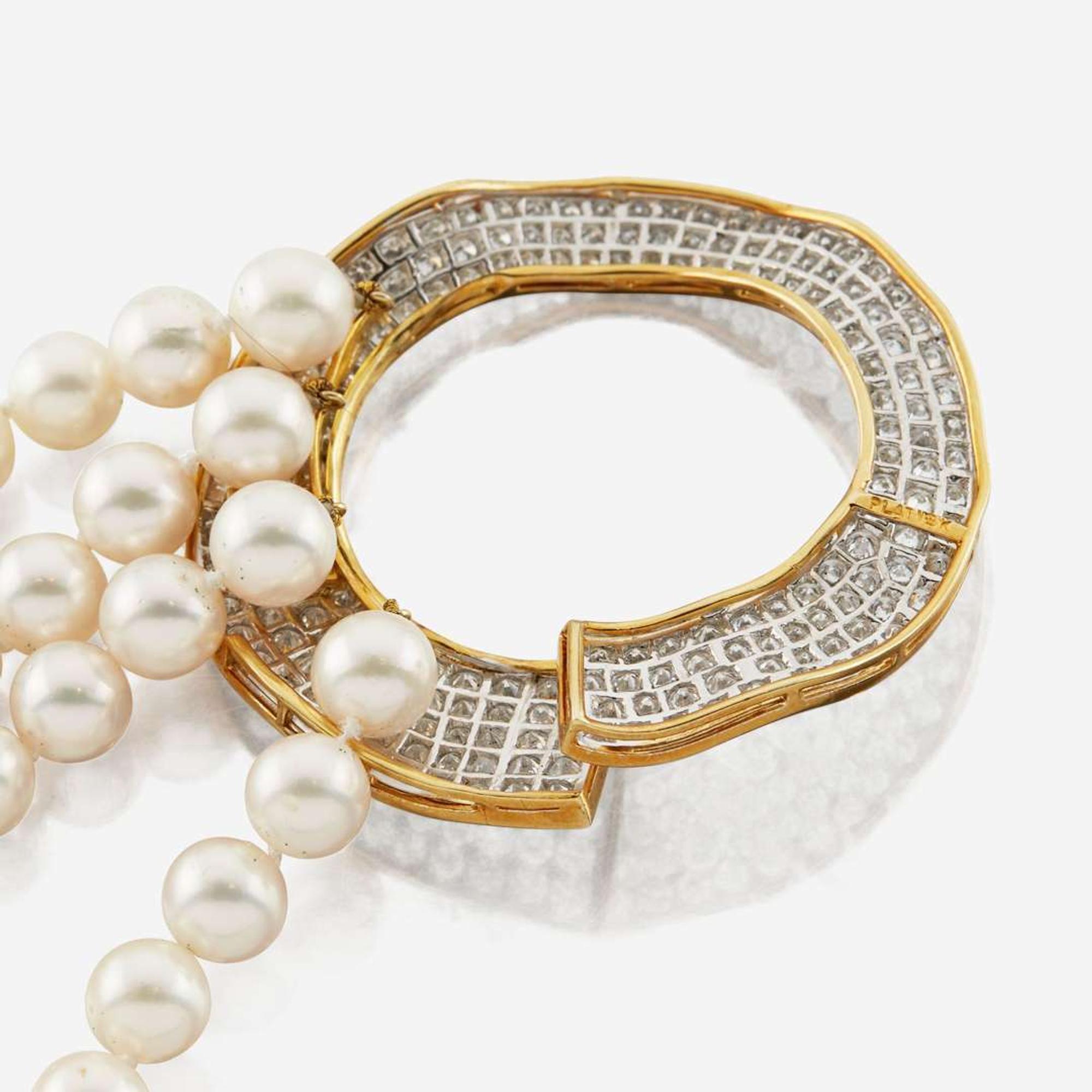 A cultured pearl, diamond, gold, and platinum necklace