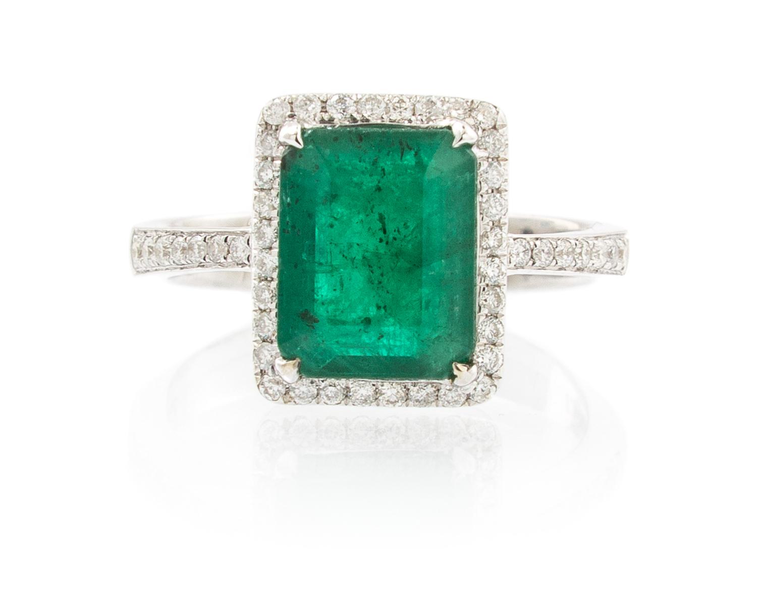 A 14 Karat White Gold, Emerald and Diamond Ring, 3.30 dwts.