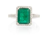 A 14 Karat White Gold, Emerald and Diamond Ring, 3.30 dwts.