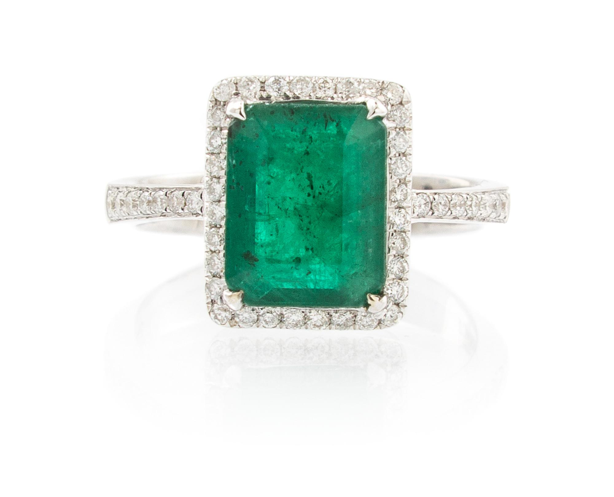 A 14 Karat White Gold, Emerald and Diamond Ring, 3.30 dwts.