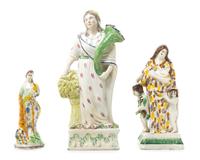 A Group of Three Staffordshire Figures Height of tallest 12 inches.