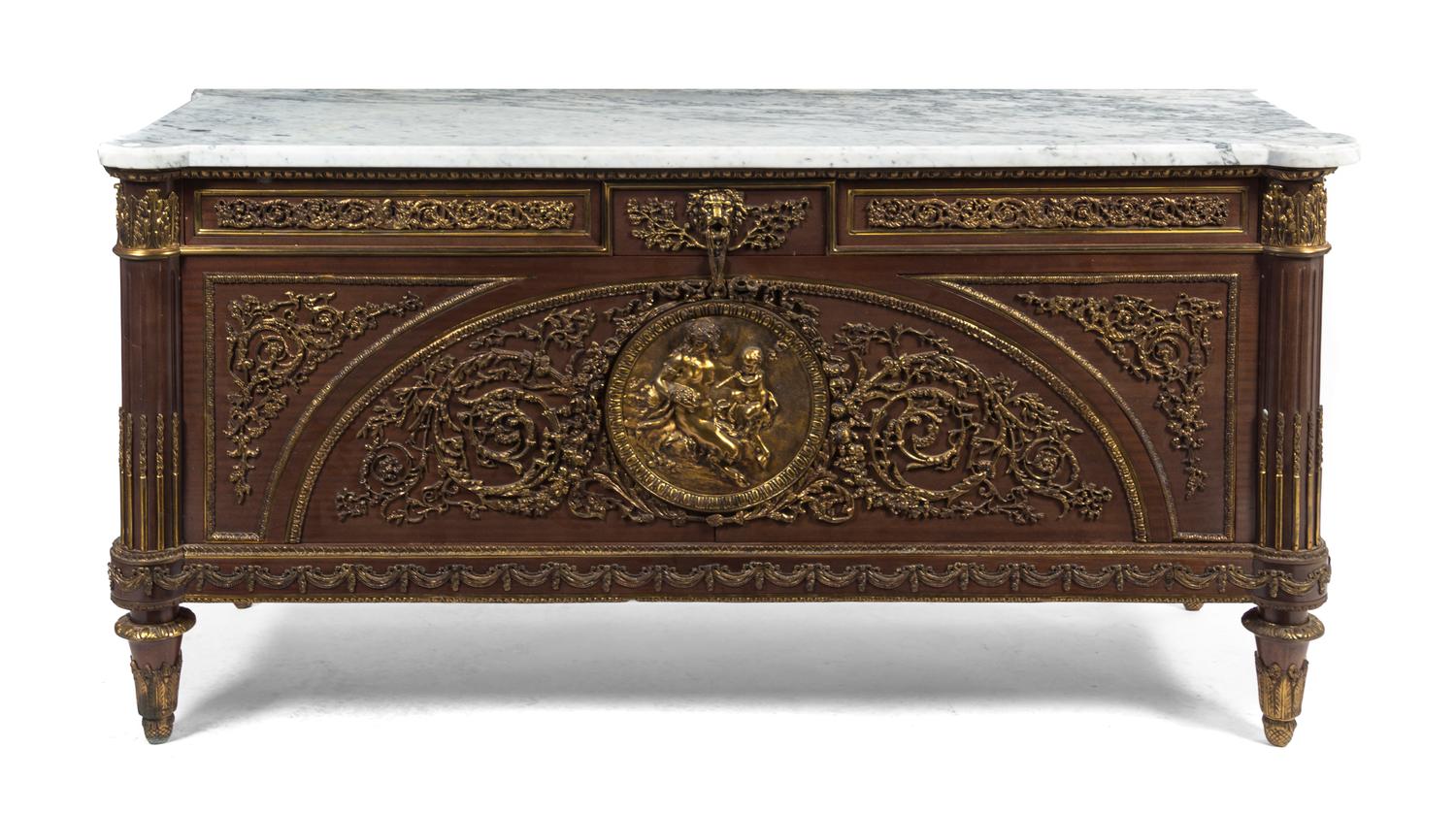 A Louis XVI Style Gilt Bronze Mounted Commode, after a model by Guillaume Benneman, Height 36 1/4 x width 71 x depth 26 1/2 inches.