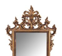An Italian Baroque Style Carved and Parcel Gilt Mirror