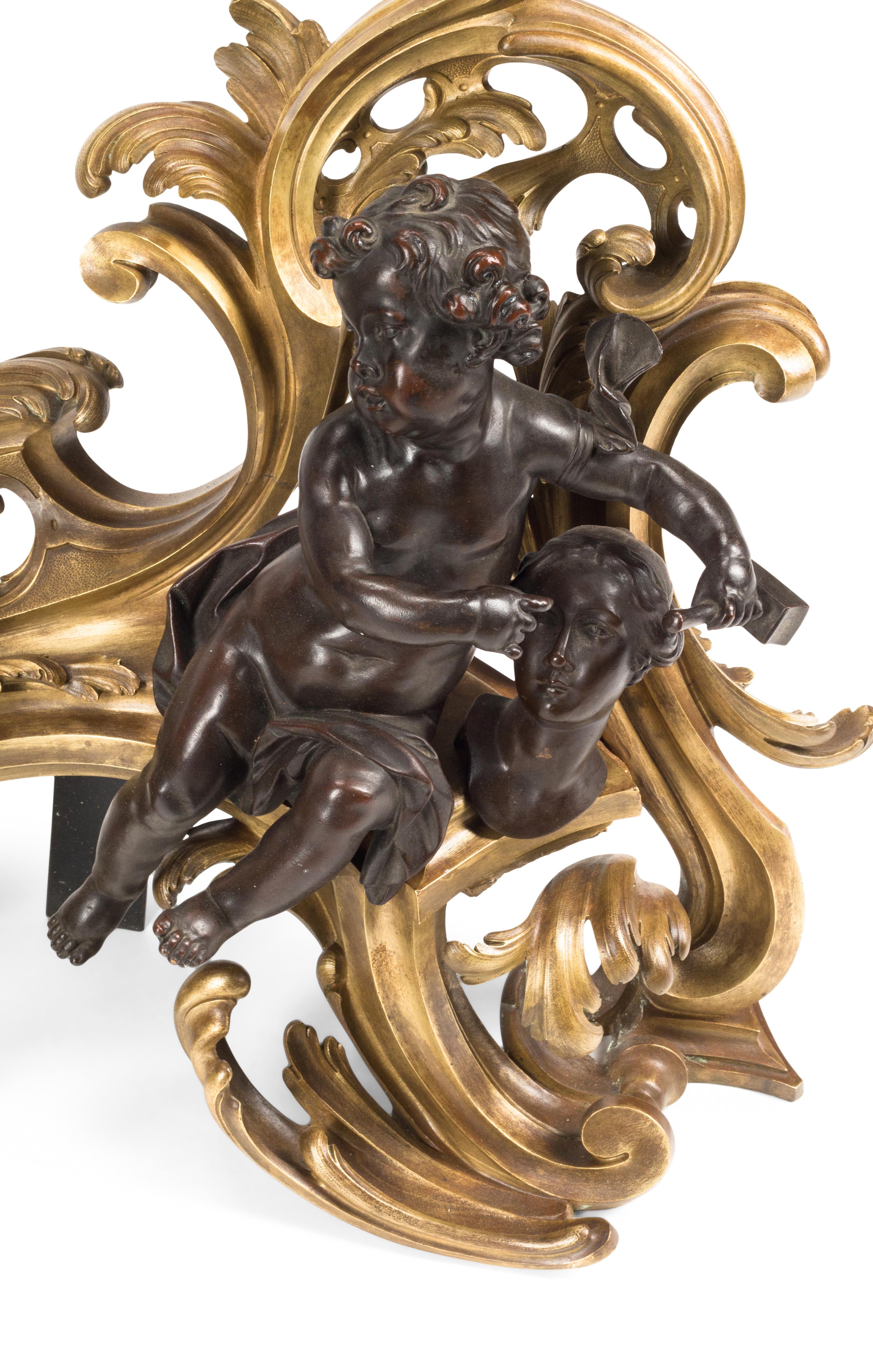 A Pair of Louis XV Style Gilt and Patinated Bronze Figural Chenets