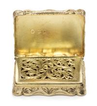 A Victorian Silver-Gilt Vinaigrette, Edward Smith, Birmingham, 1847, the lid decorated with a river scene, the underside centered by a