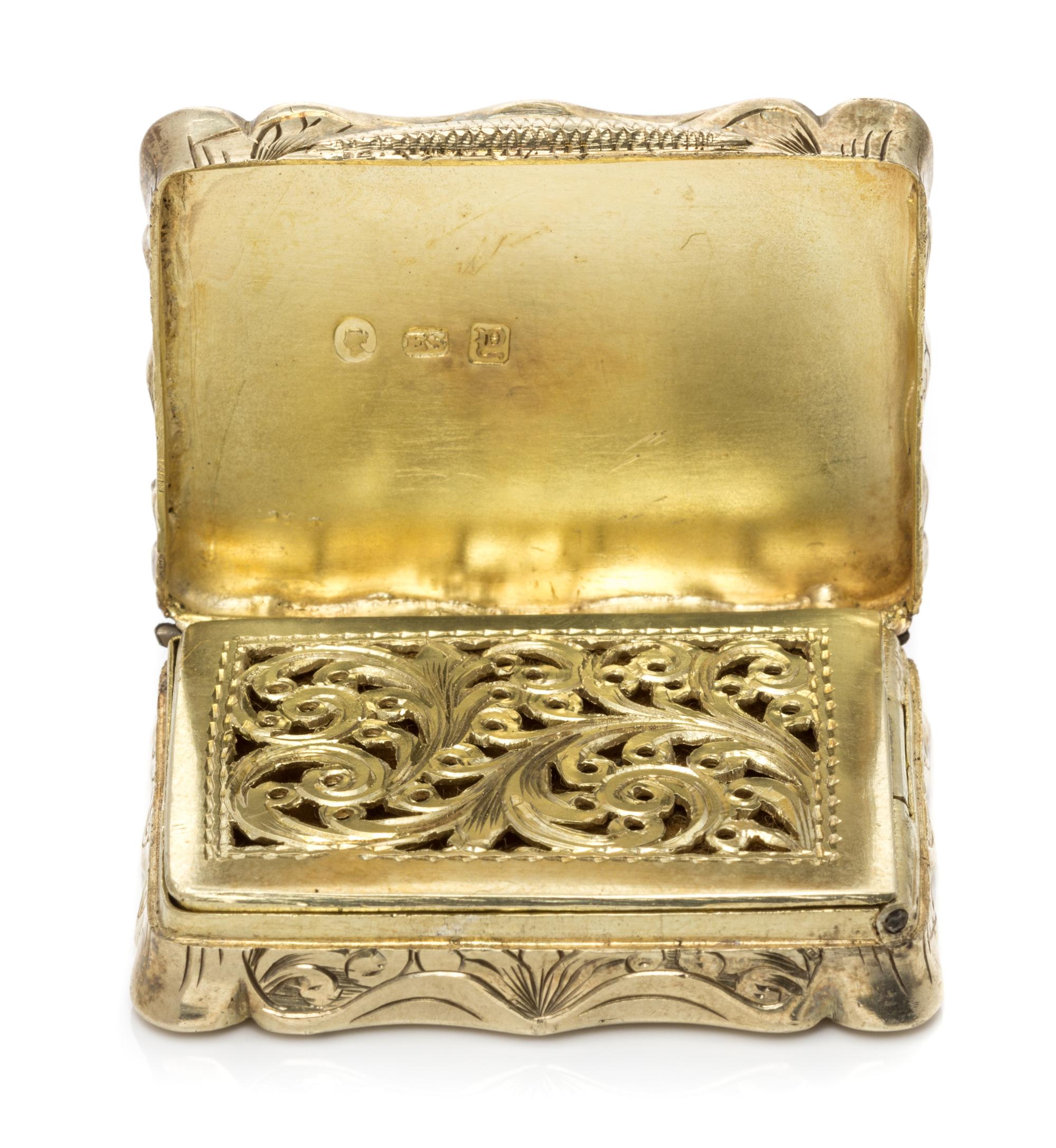 A Victorian Silver-Gilt Vinaigrette, Edward Smith, Birmingham, 1847, the lid decorated with a river scene, the underside centered by a