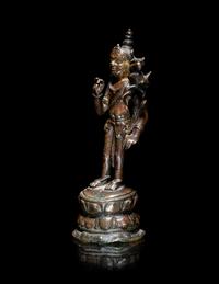 A Nepalese Parcel-Gilt Bronze Figure of Standing Avalokiteshvara