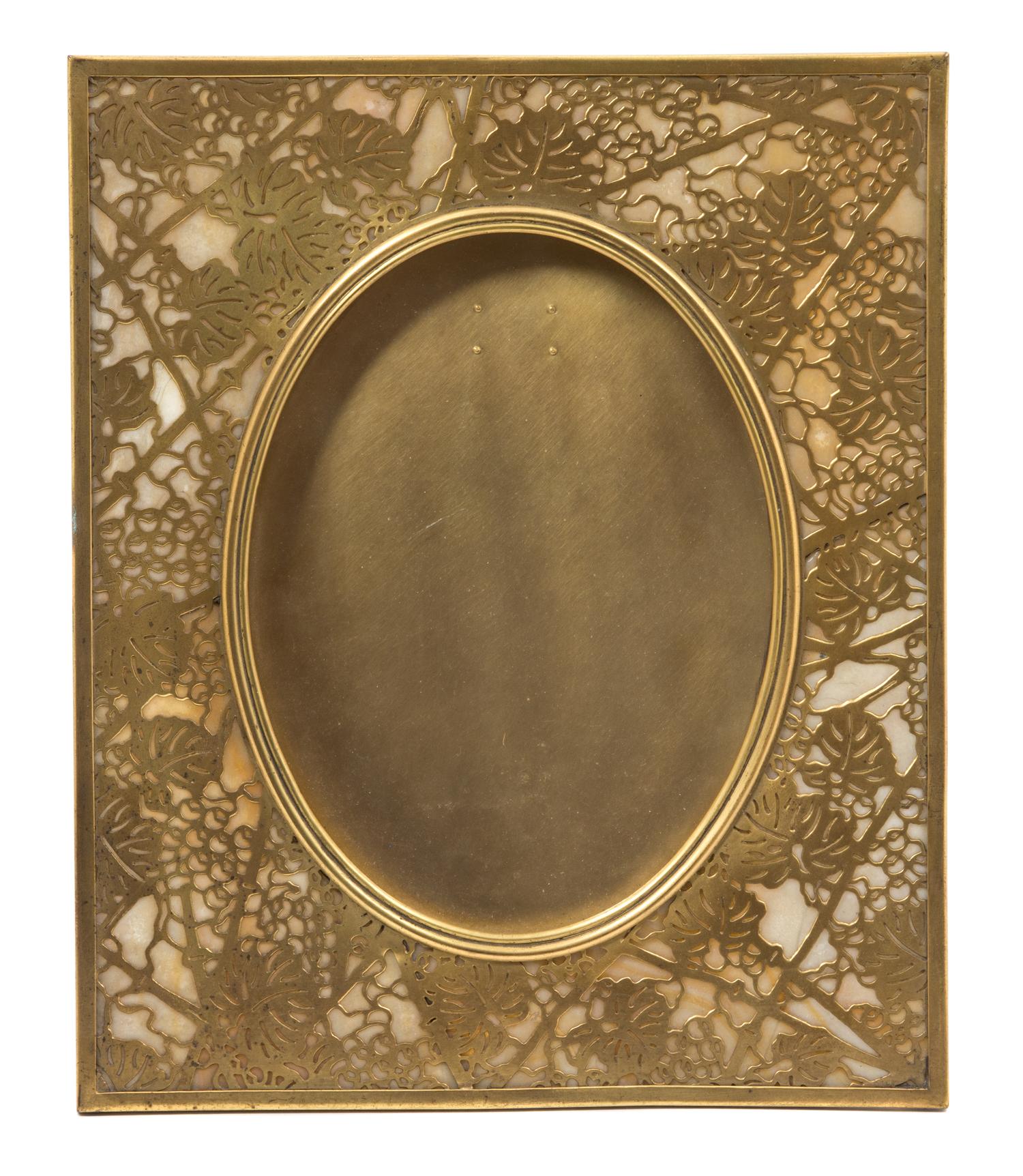 A Tiffany Studios Gilt Bronze Picture Frame 11 5/8 x 9 5/8 inches. — 20TH CENTURY