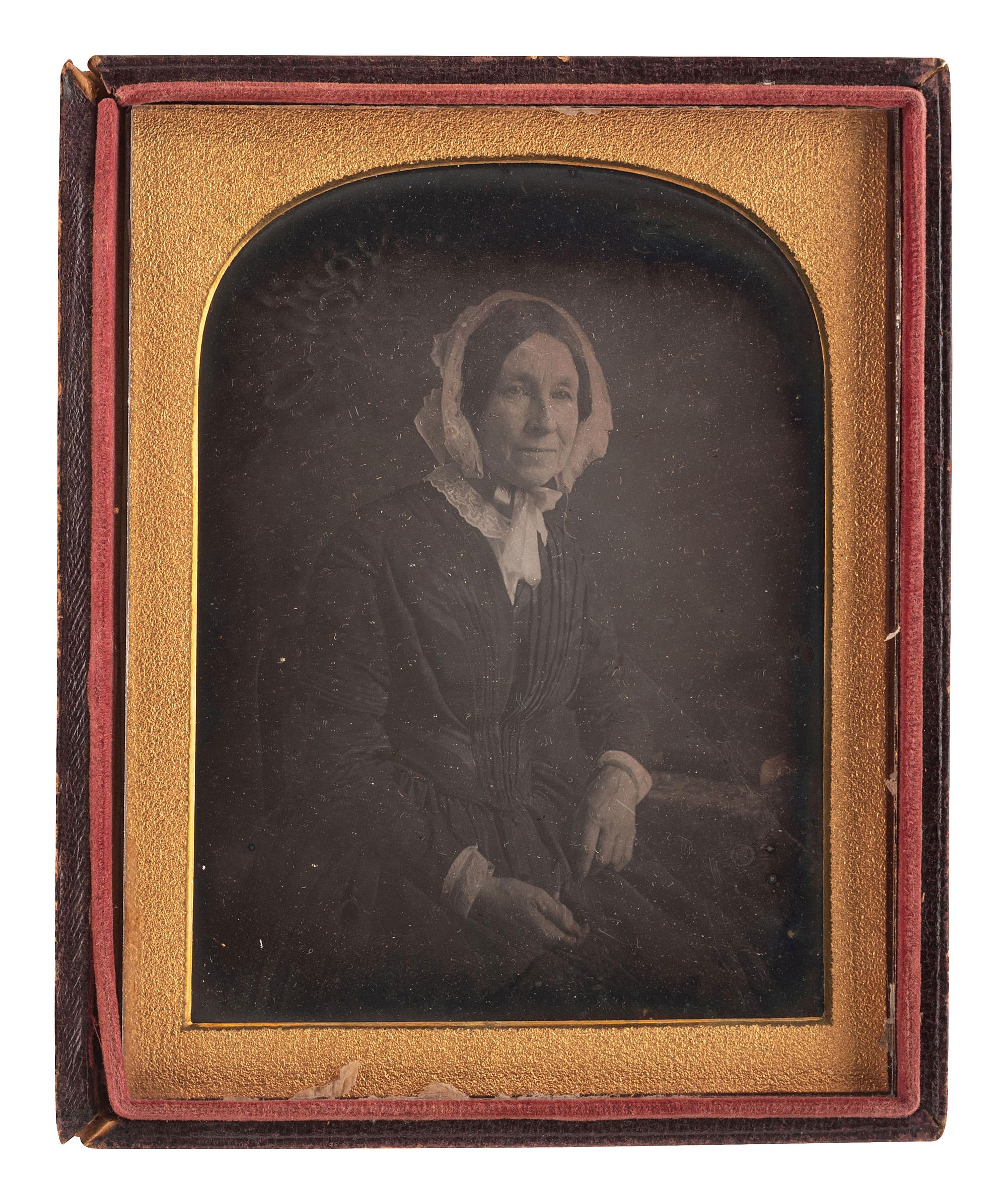[EARLY PHOTOGRAPHY]. A pair of half plate daguerreotypes, highlighted by large group portrait by T.M. Parker, comprising: