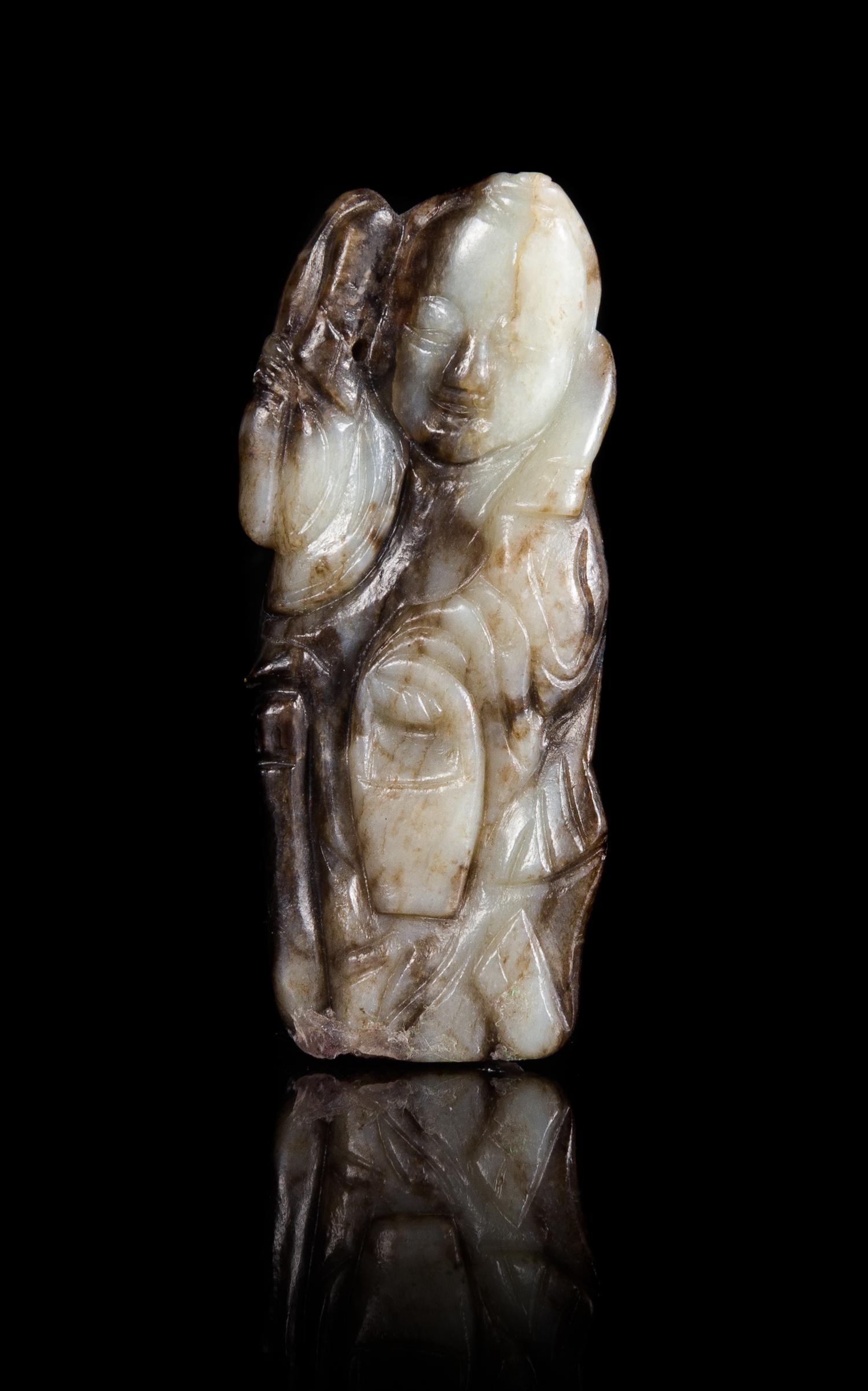 A Black and White Jade Figure of a Standing Immortal Height 3 1/2 inches.
