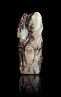 A Black and White Jade Figure of a Standing Immortal Height 3 1/2 inches.