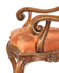 A Pair of Italian Rococo Style Carved and Painted Armchairs