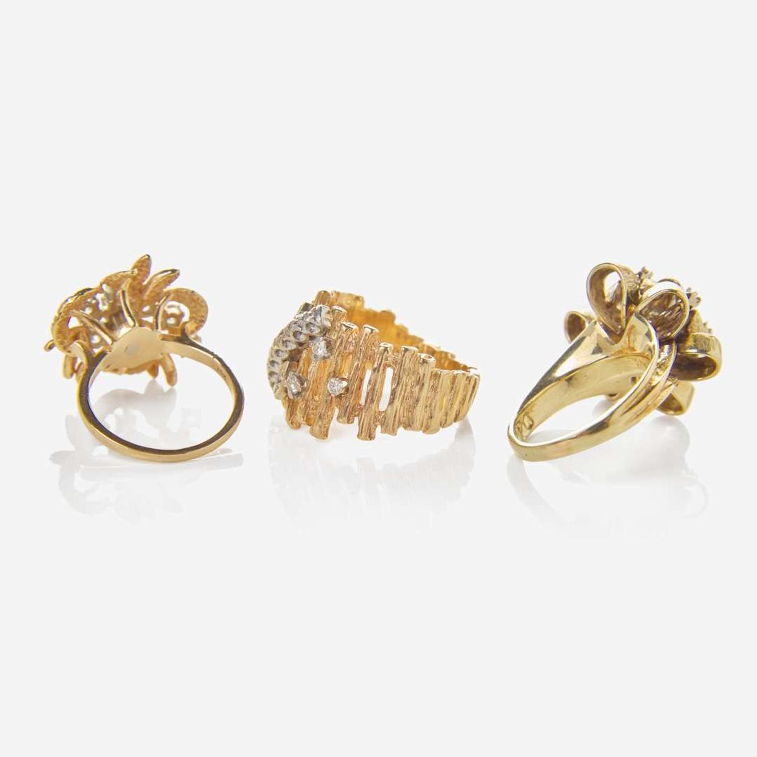 A Collection of Three Yellow Gold and Diamond Rings