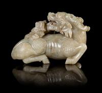 A Celadon Jade Figure of a Qilin Length 5 1/2 inches.