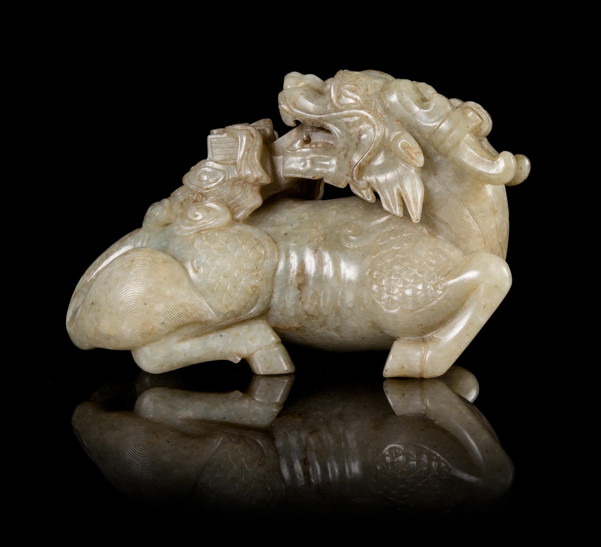 A Celadon Jade Figure of a Qilin Length 5 1/2 inches.