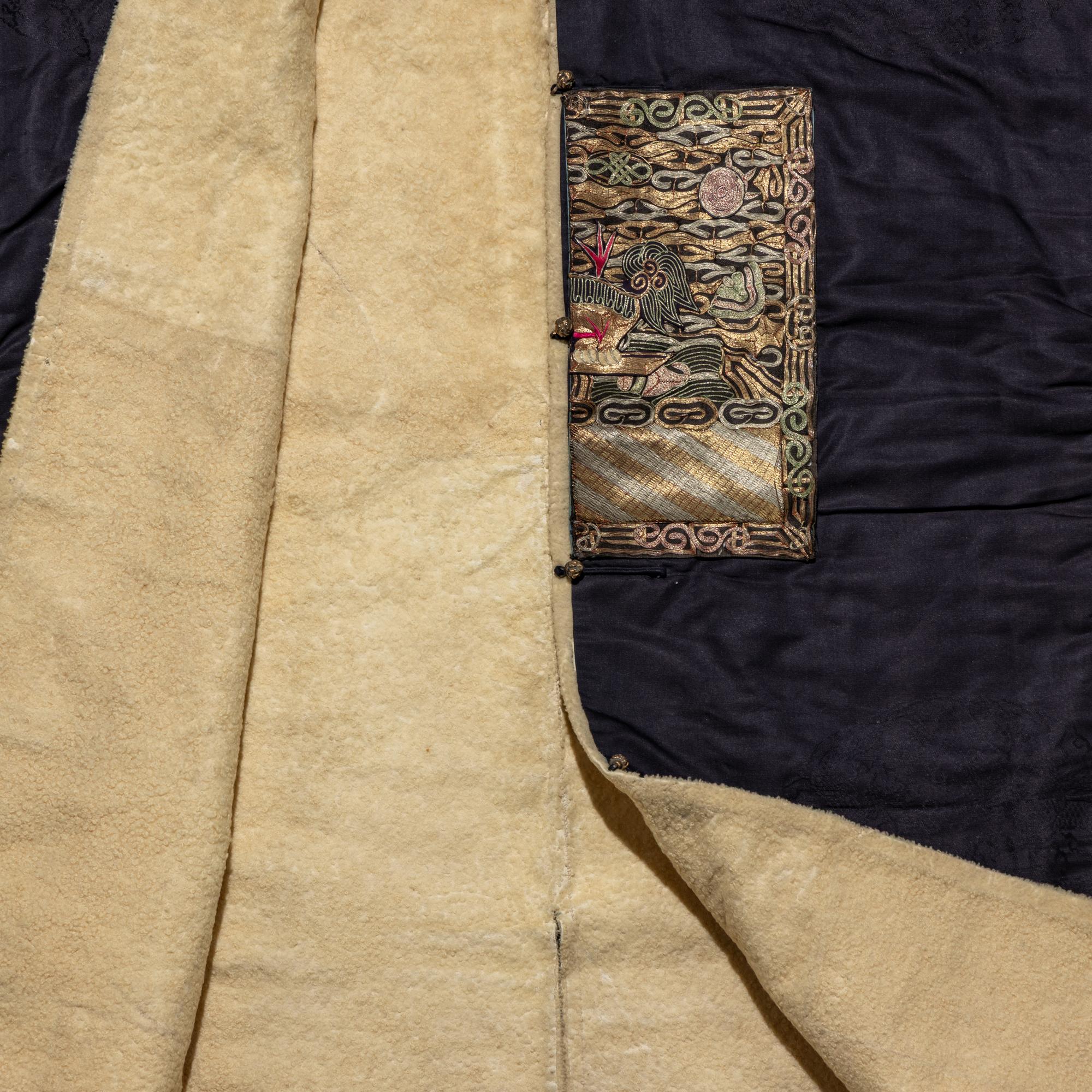 A Chinese Dark Blue Silk Fur Lined Official's Robe, Bufu , Late Qing Dynasty — 清晚期 石青地四品武官冬補服