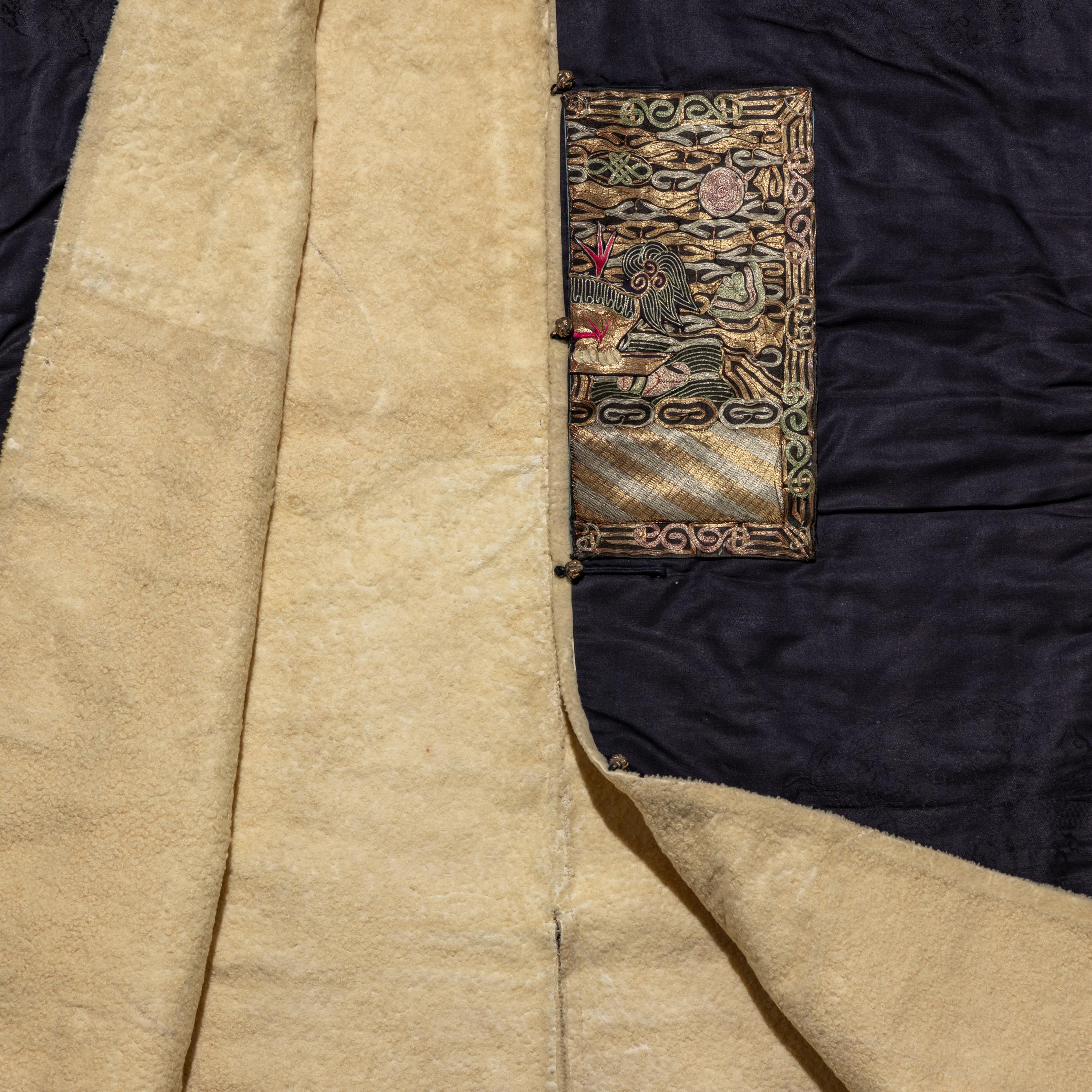 A Chinese Dark Blue Silk Fur Lined Official's Robe, Bufu , Late Qing Dynasty — 清晚期 石青地四品武官冬補服