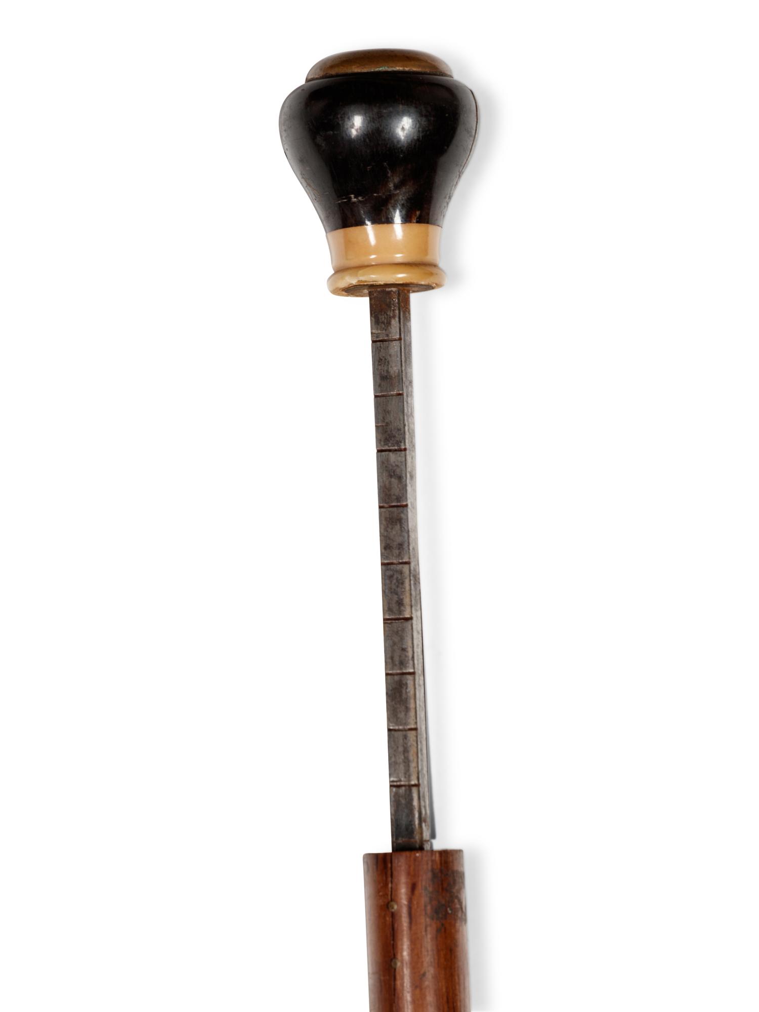 A Continental Brass and Bone Inlaid Walnut Tailor's 'System' Walking Stick