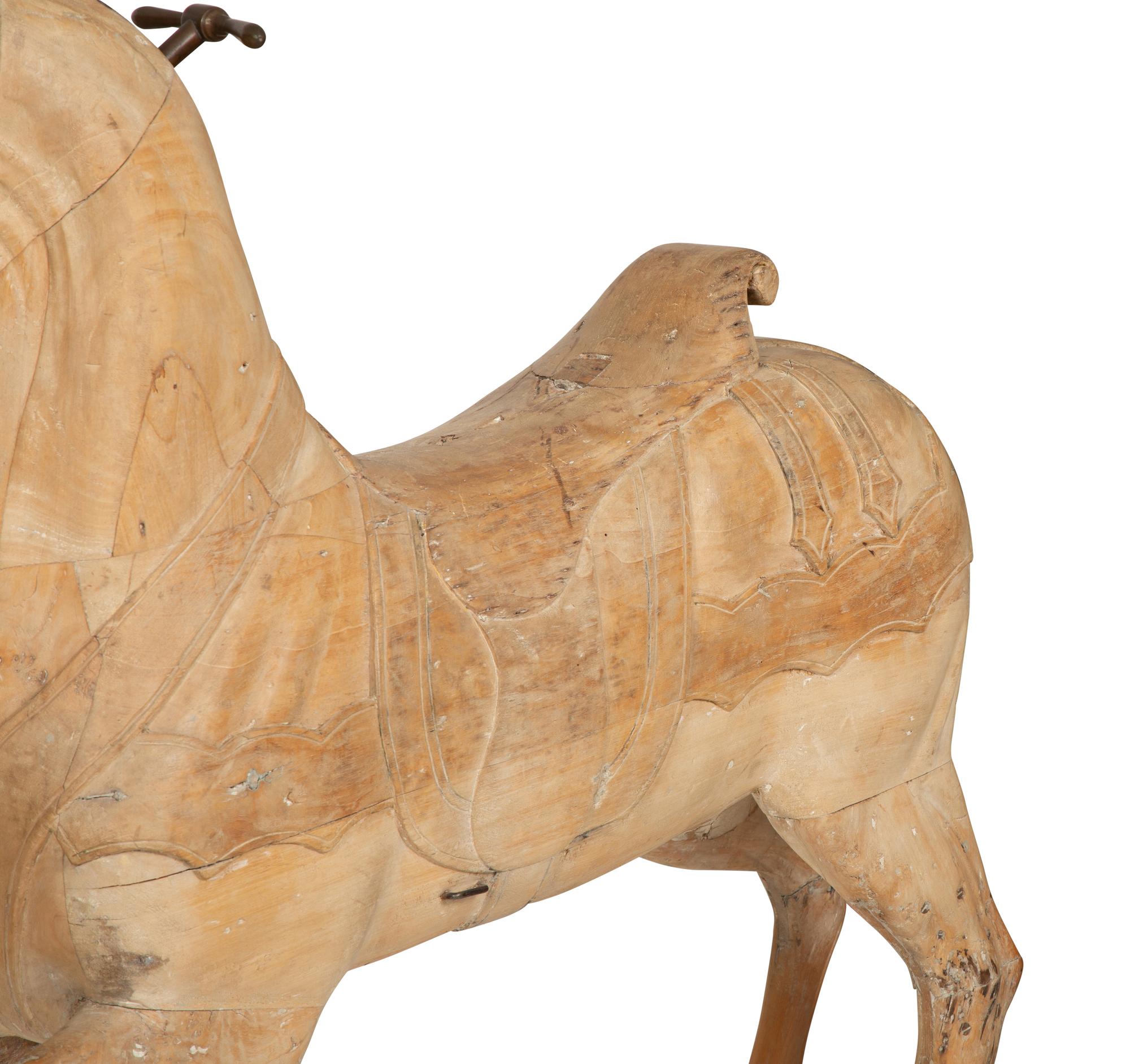 A Pair of Italian Carved Wood Carousel Horses in the Manner of Gustav Dentzel