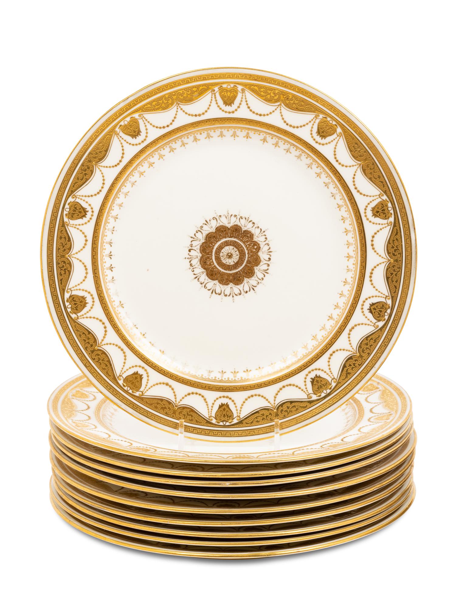 Two Sets of Gilt Porcelain Dinner Plates