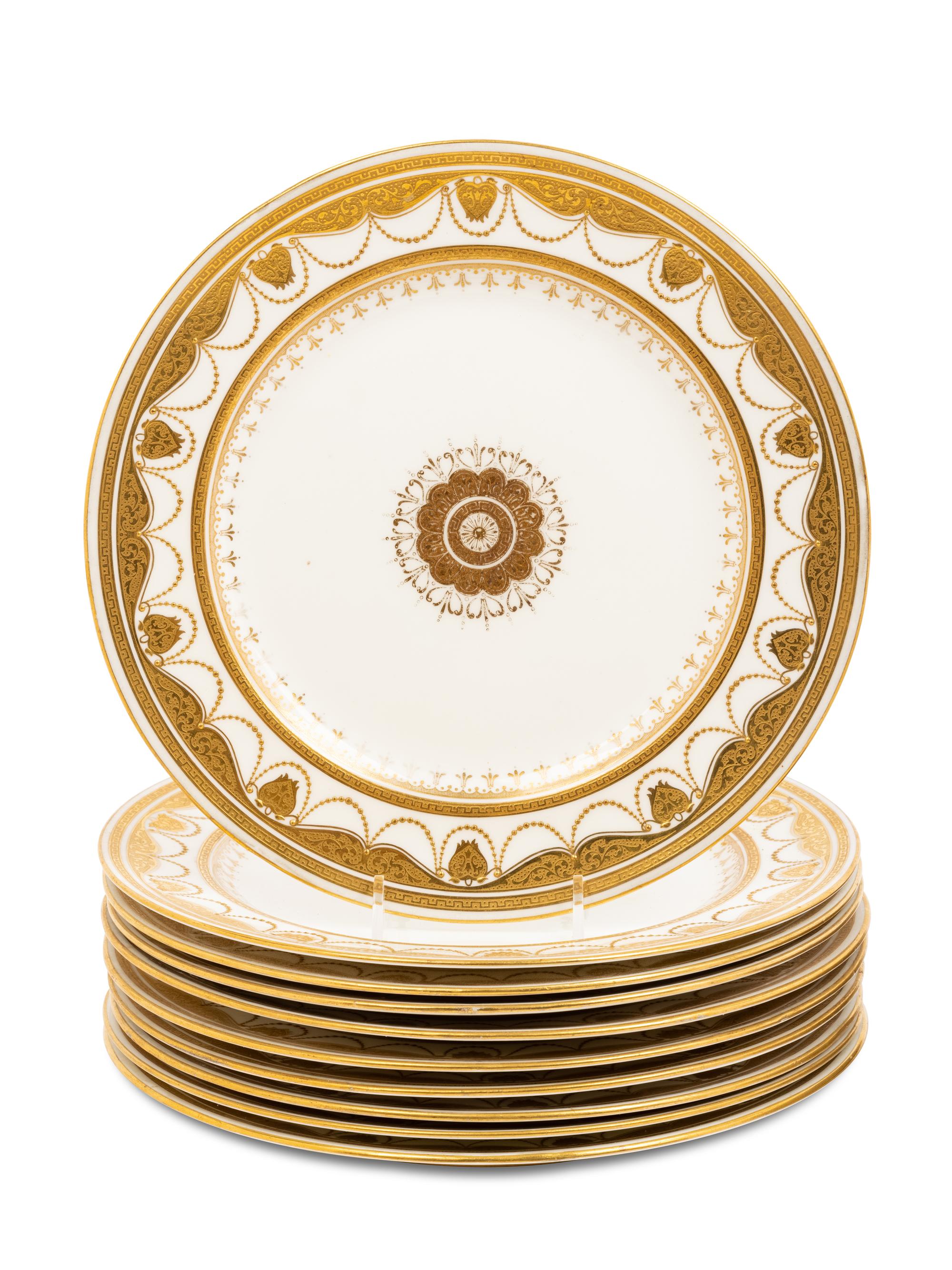 Two Sets of Gilt Porcelain Dinner Plates