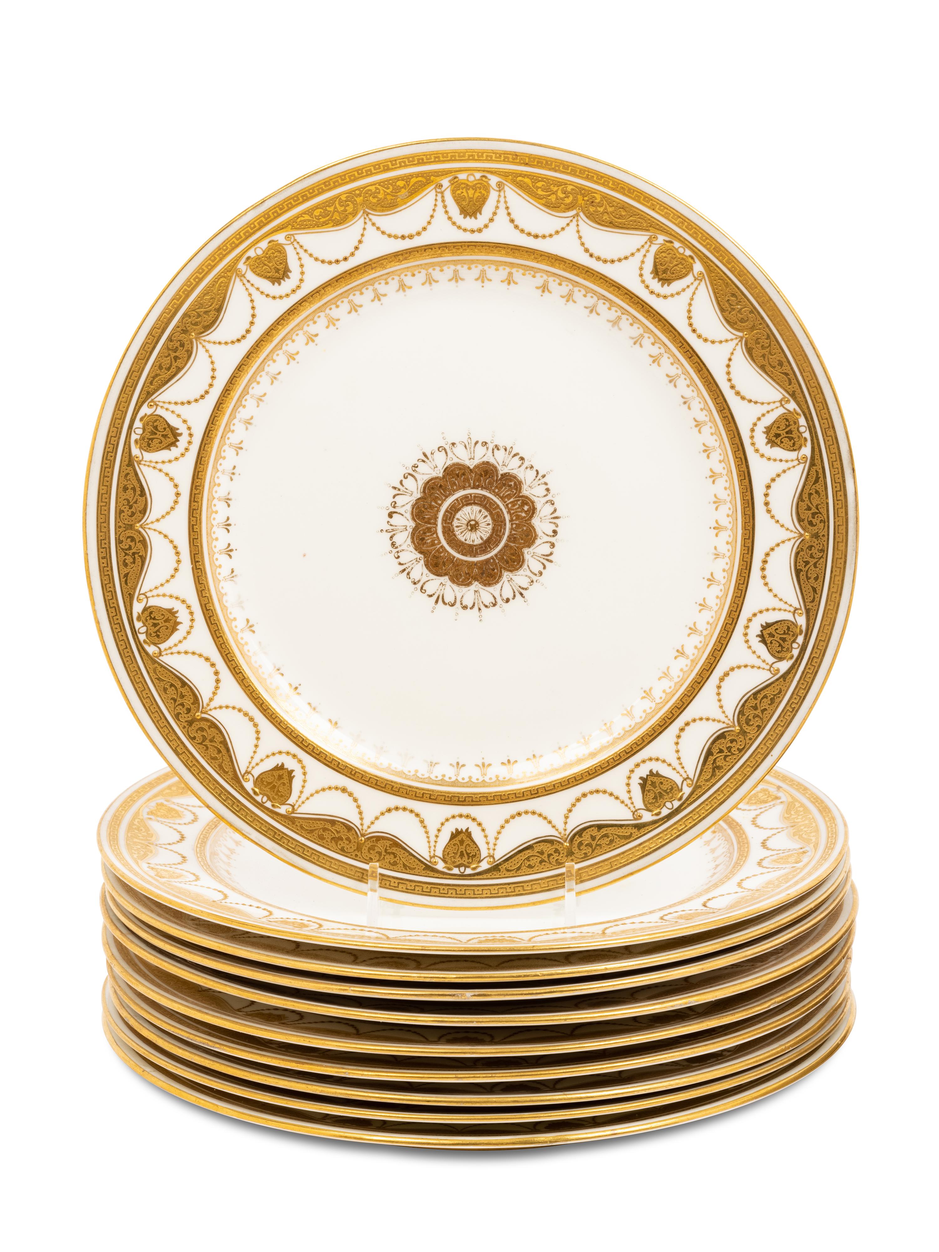 Two Sets of Gilt Porcelain Dinner Plates
