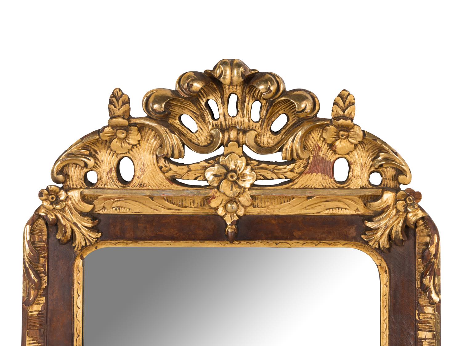 A Scandinavian Rococo Walnut and Parcel-Gilt Mirror