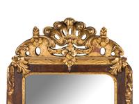 A Scandinavian Rococo Walnut and Parcel-Gilt Mirror