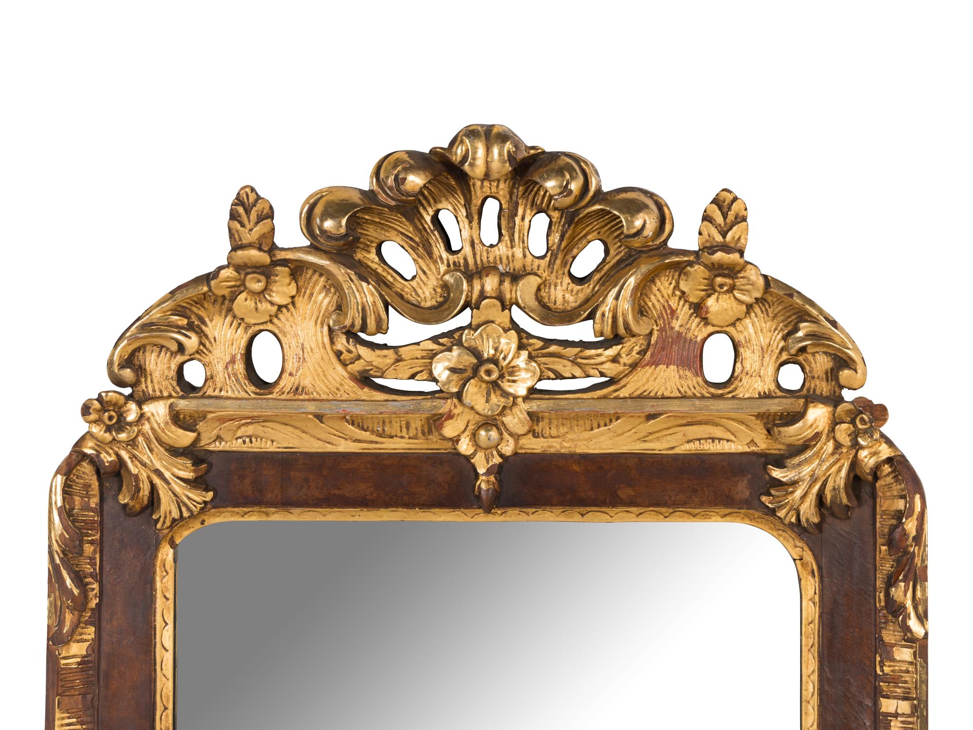 A Scandinavian Rococo Walnut and Parcel-Gilt Mirror