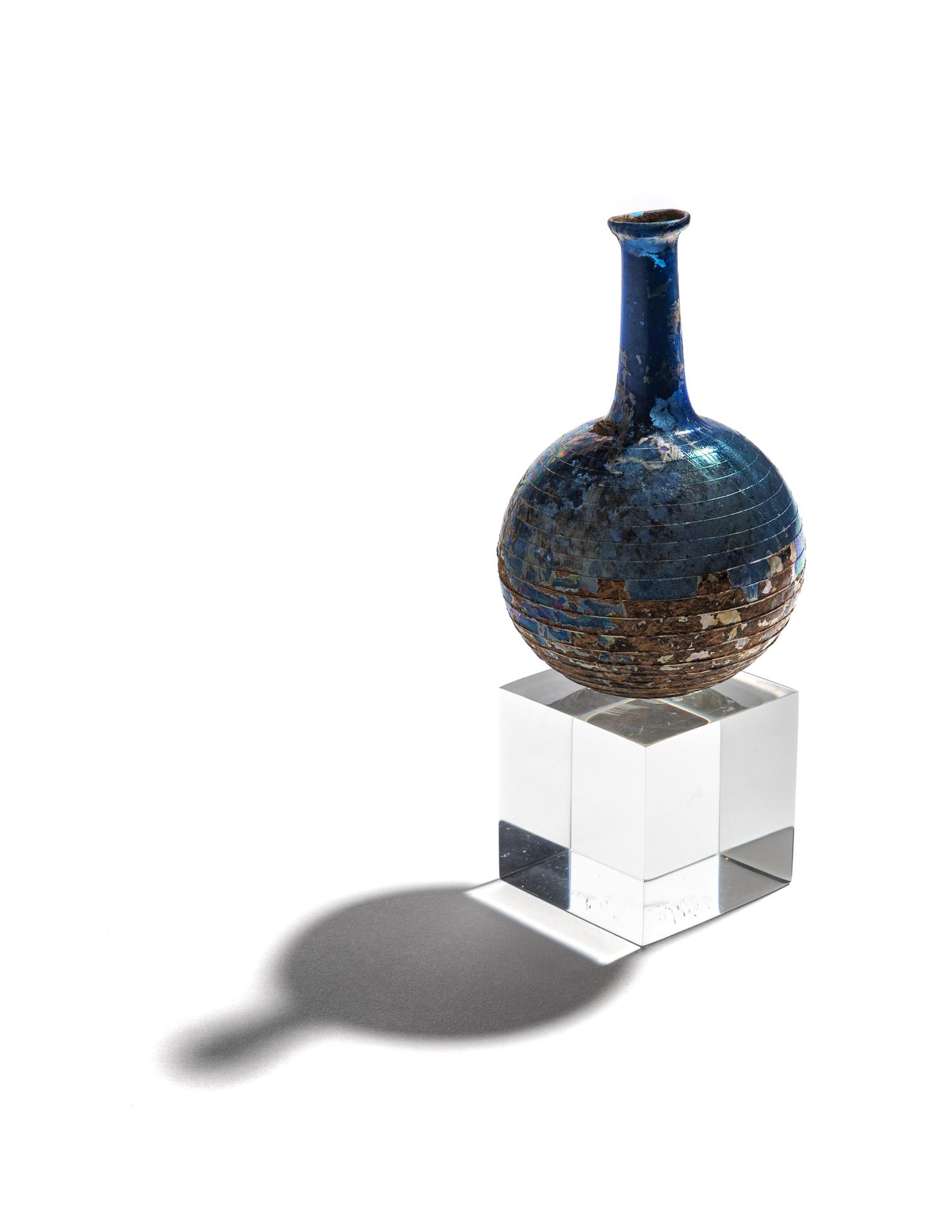 A Roman Blue Glass Bottle with Spiral Trail