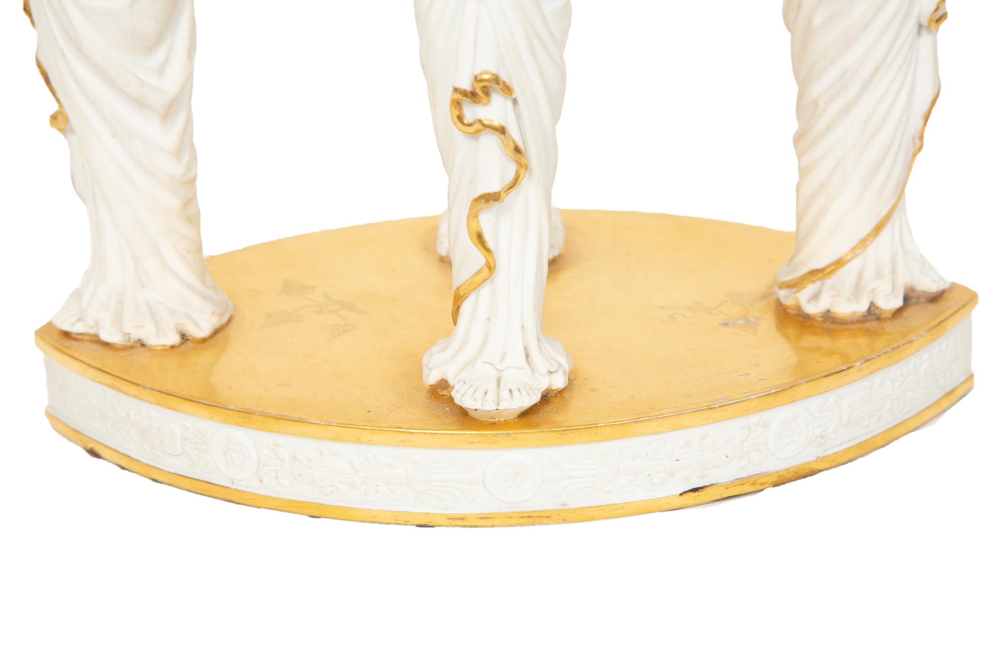 A Paris Porcelain Egyptian Revival Parcel Gilt Bisque Porcelain Centerpiece