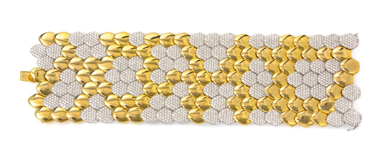 An 18 Karat Bicolor Gold and Diamond Scale Motif Bracelet, 125.90 dwts.