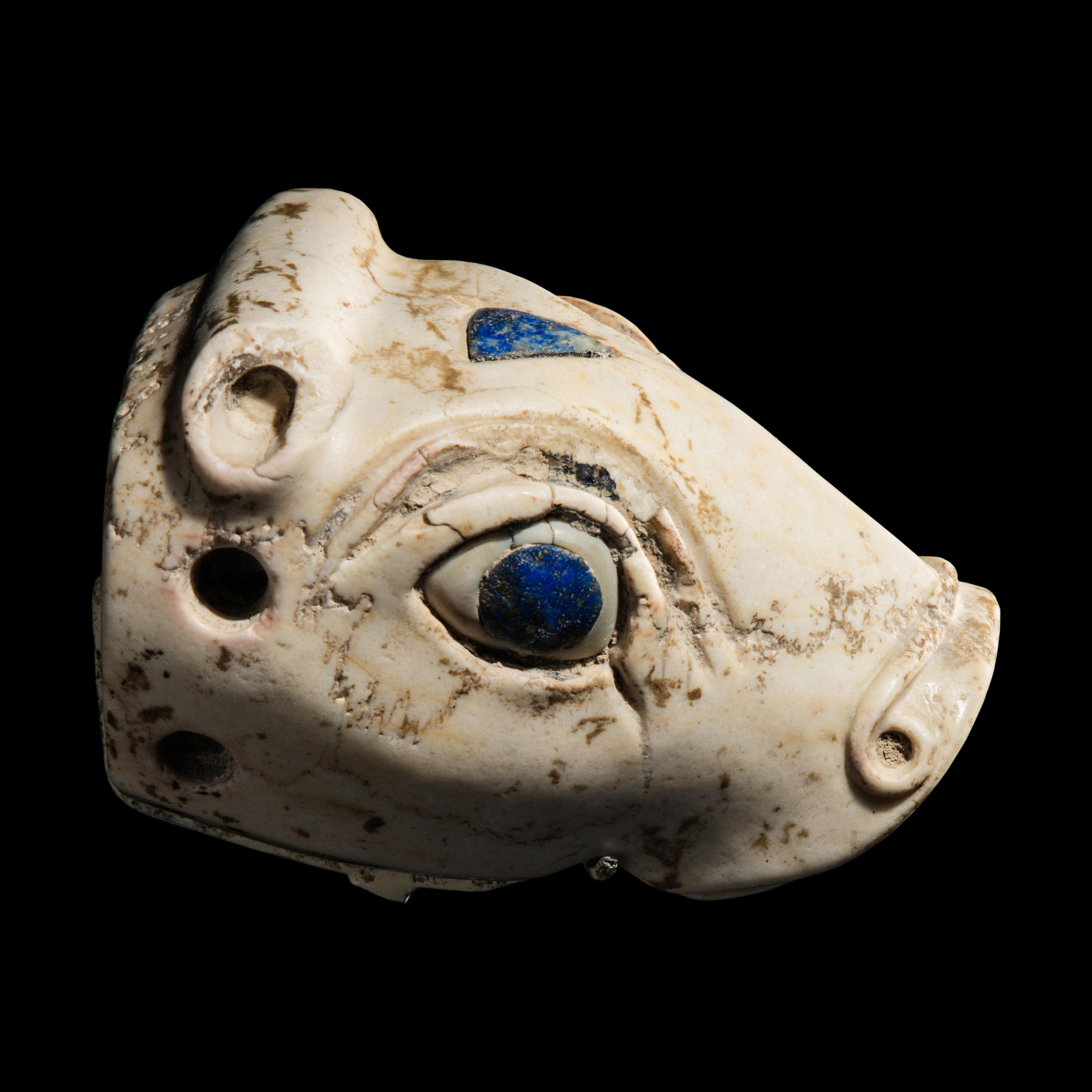 A Mesopotamian Marble and Lapis Lazuli Inlay Bull Head