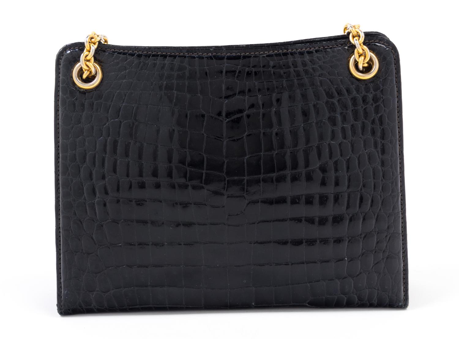 A Gucci Black Crocodile Handbag, 9.5" x 7.5" x 2.5"; Strap drop: 5.5".