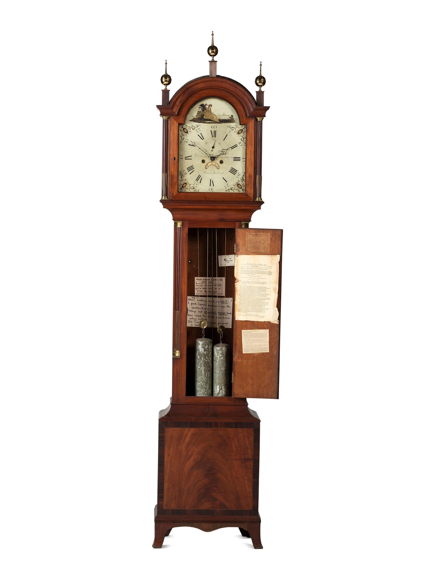A Federal Carved and Inlaid, Brass-Mounted Mahogany Tall Case Clock