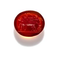 A Roman Carnelian Intaglio with Eros Driving a Biga