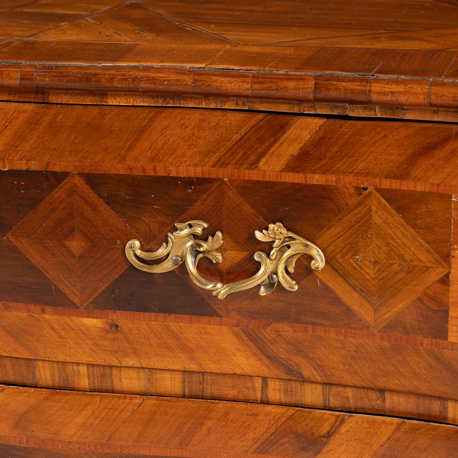 A Continental Parquetry Chest of Drawers