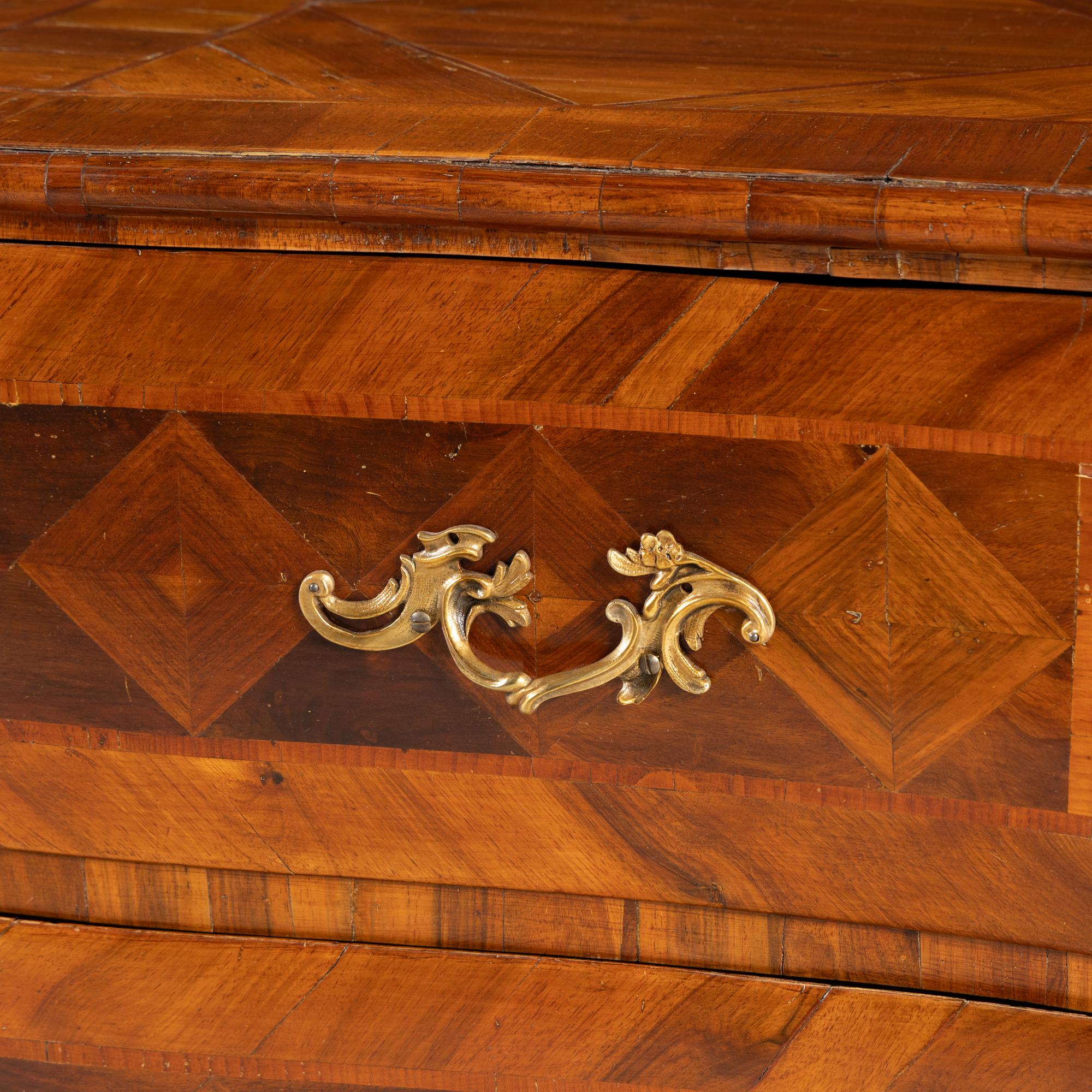 A Continental Parquetry Chest of Drawers