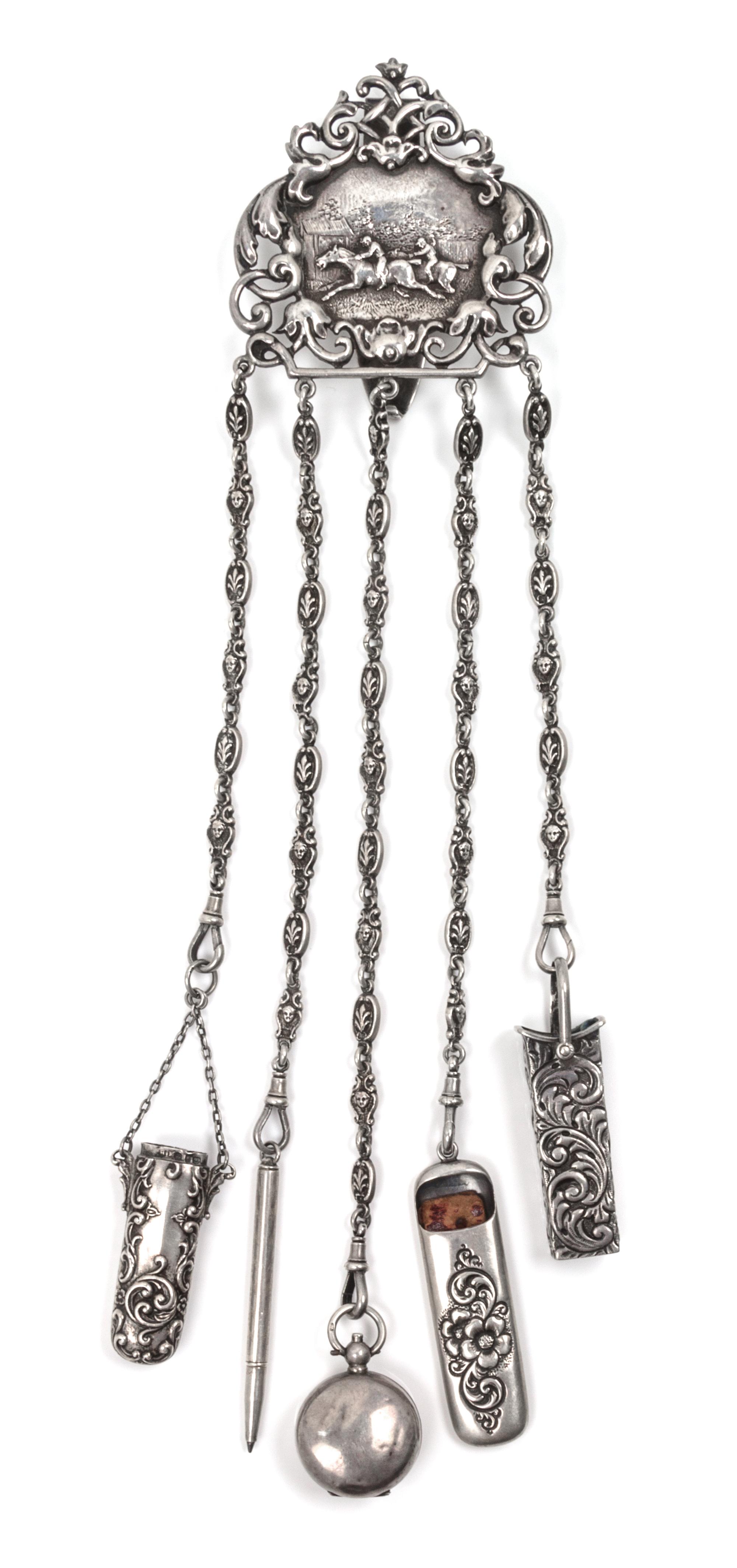 A Victorian Silver Chatelaine and Accessories, George Howson, London, 1898 and others, the belt clip worked to show a hunting scene sur