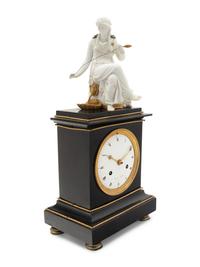An Empire Gilt Metal Mounted Figural Mantel Clock
