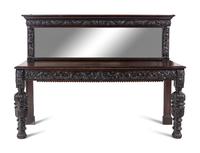 A Jacobean Style Carved Oak Sideboard and Mirror