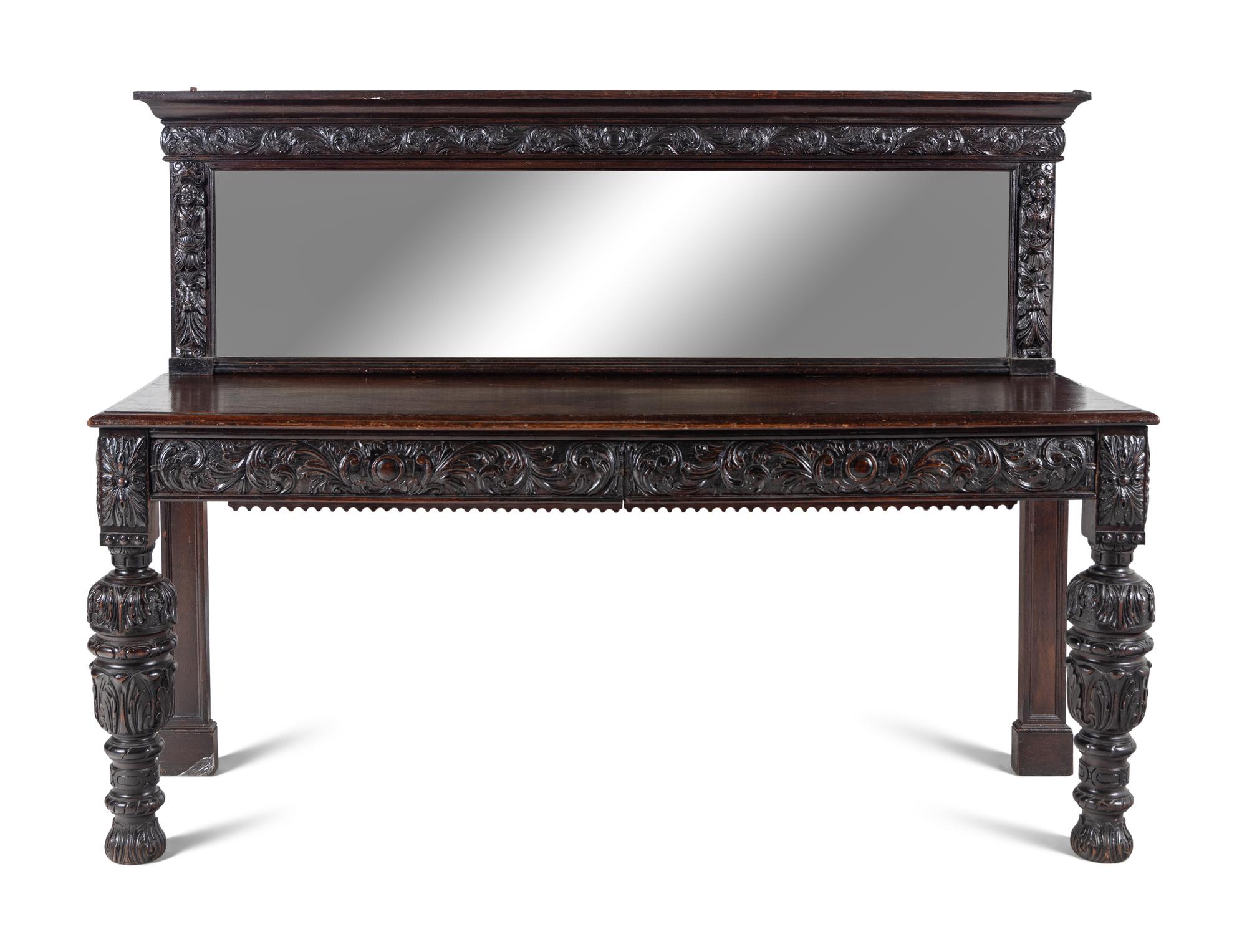 A Jacobean Style Carved Oak Sideboard and Mirror