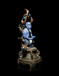 A Chinese Carved Lapis Lazuli Figure of a Fisherman