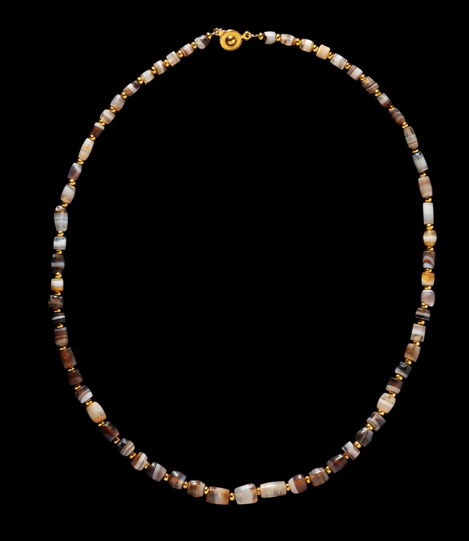 A Western Asiatic Banded Agate Necklace